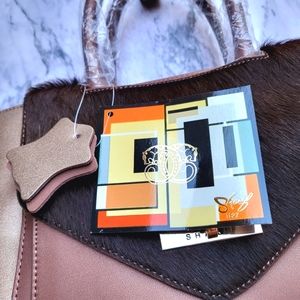 Genuine leather brown bronze Sharif purse backpack or shoulder bag.